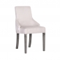 Preview: Stuhl mit weißem Bezug und dunklen Beinen.