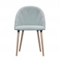 Preview: Stuhl mit hellblauem Bezug und Nähten auf der Lehne.